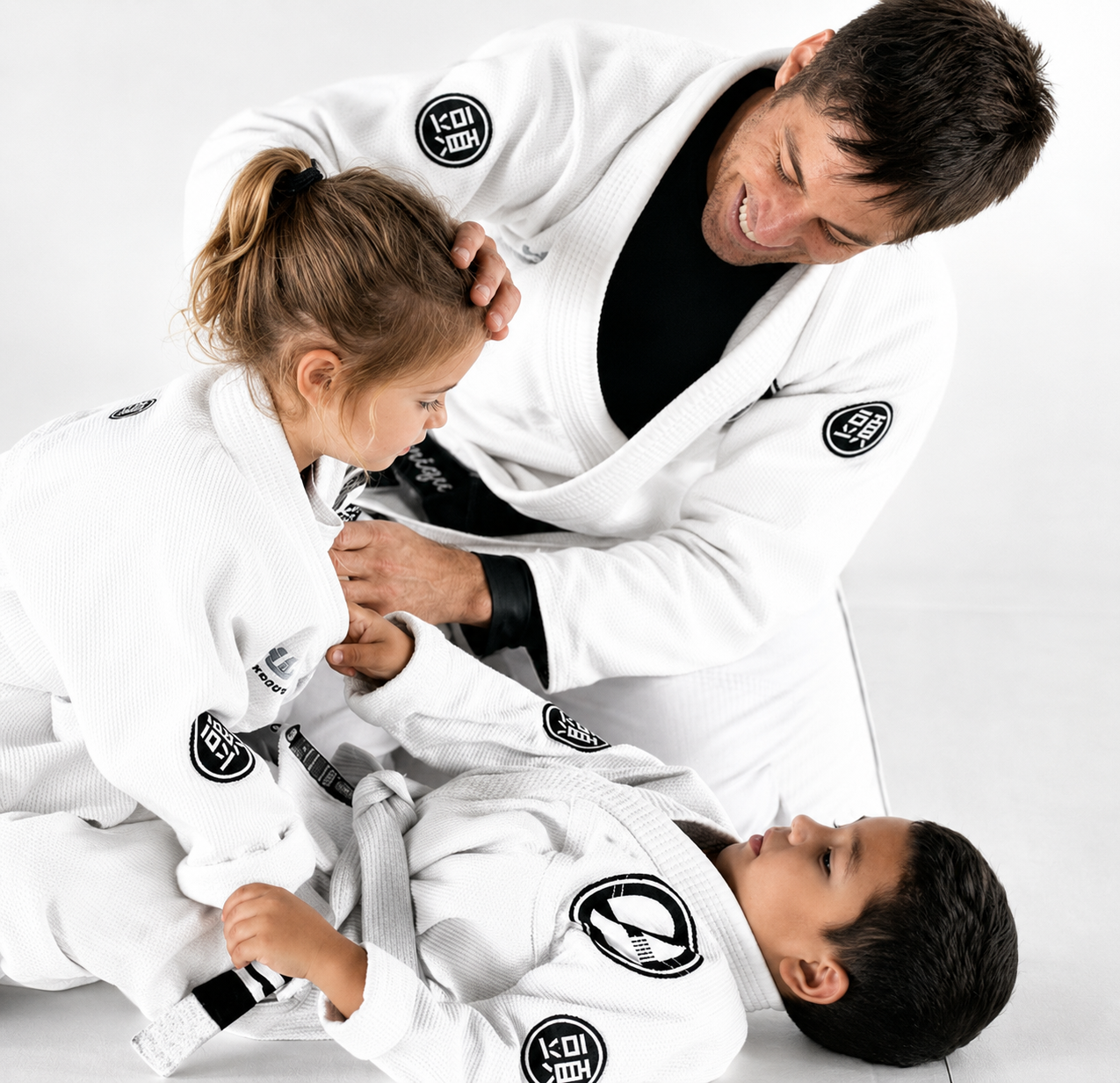 Professor Henrique Gama Filho teaching Mini Champions Brazilian Jiu-Jitsu students on the academy mats